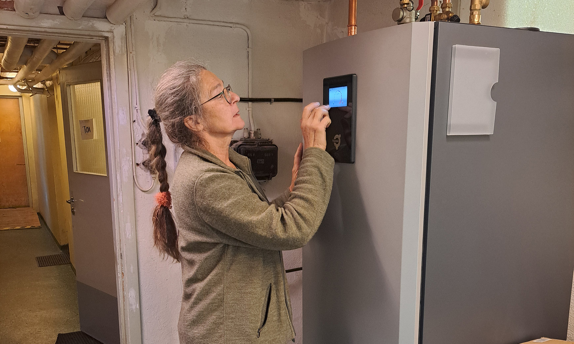 A woman checking out a heater.